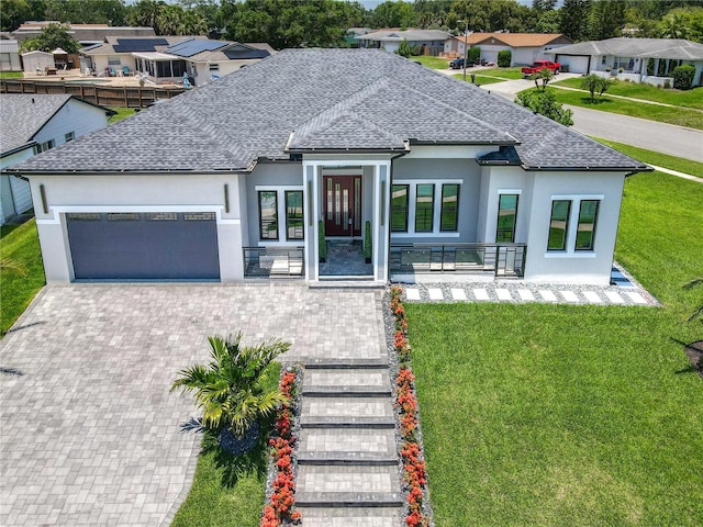 601 Green Briar Blvd, Altamonte Springs, FL 32714 - view of front facade featuring stucco siding, a garage, roof with shingles, and a residential view