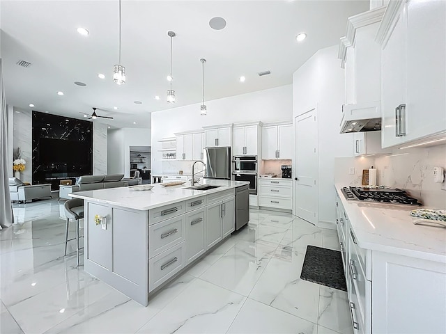 601 Green Briar Blvd, Altamonte Springs, FL 32714 - kitchen featuring stainless steel appliances, ceiling fan, a sink, white cabinetry, and open floor plan