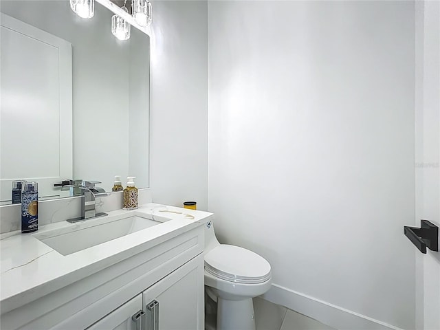601 Green Briar Blvd, Altamonte Springs, FL 32714 - bathroom with toilet, vanity, tile patterned floors, and baseboards