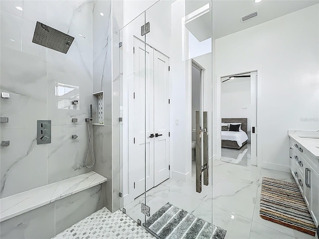 601 Green Briar Blvd, Altamonte Springs, FL 32714 - ensuite bathroom featuring a marble finish shower, baseboards, marble finish floors, toilet, and vanity