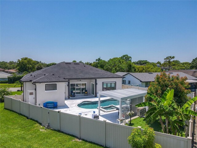 601 Green Briar Blvd, Altamonte Springs, FL 32714 - back of property featuring stucco siding, roof with shingles, a patio, and a hot tub