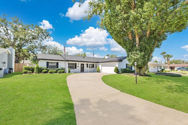 2460 Worthington Rd, Maitland, FL 32751 - single story home featuring driveway, an attached garage, and stucco siding