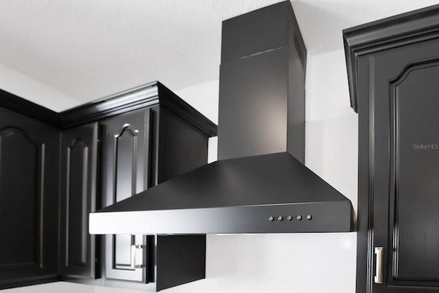 2460 Worthington Rd, Maitland, FL 32751 - detailed view of dark cabinetry and wall chimney exhaust hood