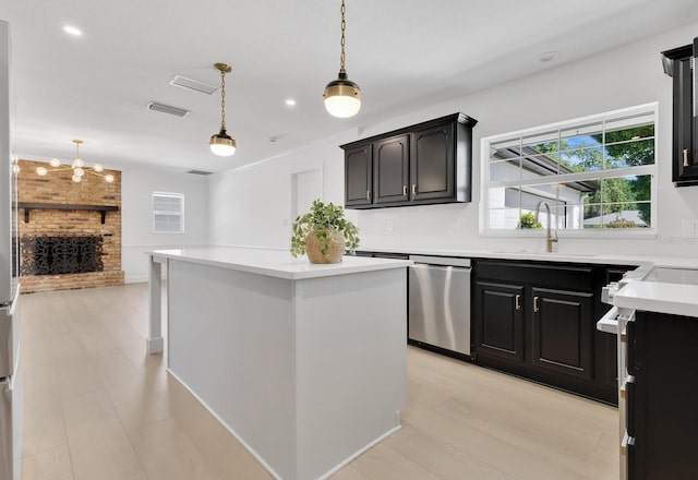 2460 Worthington Rd, Maitland, FL 32751 - kitchen featuring healthy amount of natural light, a kitchen island, stainless steel dishwasher, a sink, and recessed lighting