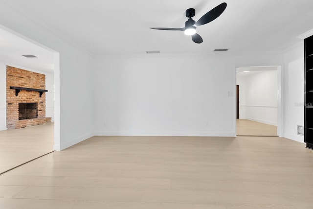 2460 Worthington Rd, Maitland, FL 32751 - unfurnished living room with light wood-style flooring, a ceiling fan, ornamental molding, a fireplace, and baseboards