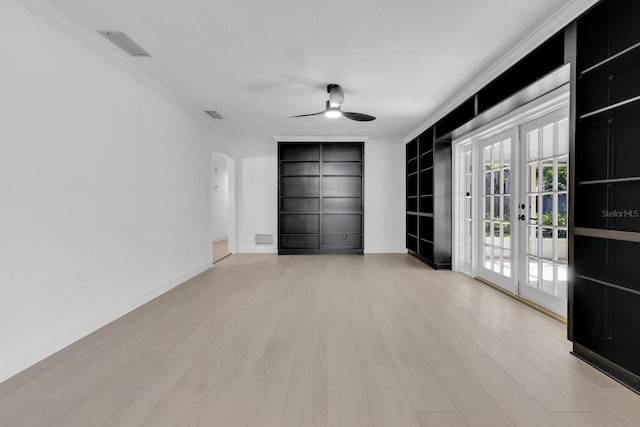2460 Worthington Rd, Maitland, FL 32751 - spare room with ornamental molding, ceiling fan, wood finished floors, built in shelves, and french doors