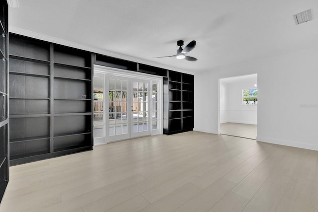 2460 Worthington Rd, Maitland, FL 32751 - unfurnished room with ceiling fan, built in shelves, wood finished floors, and baseboards