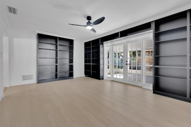 2460 Worthington Rd, Maitland, FL 32751 - empty room with french doors, ceiling fan, ornamental molding, built in shelves, and wood finished floors
