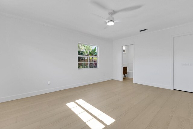 2460 Worthington Rd, Maitland, FL 32751 - unfurnished bedroom with light wood-style flooring, baseboards, ceiling fan, and ornamental molding