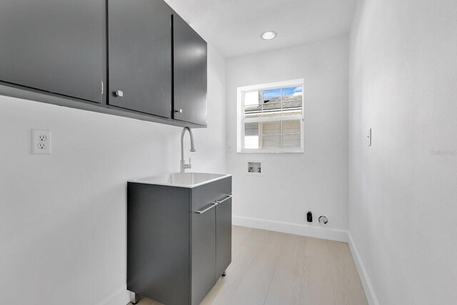 2460 Worthington Rd, Maitland, FL 32751 - washroom featuring cabinet space, washer hookup, and baseboards