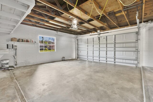 2460 Worthington Rd, Maitland, FL 32751 - garage with a garage door opener and concrete block wall