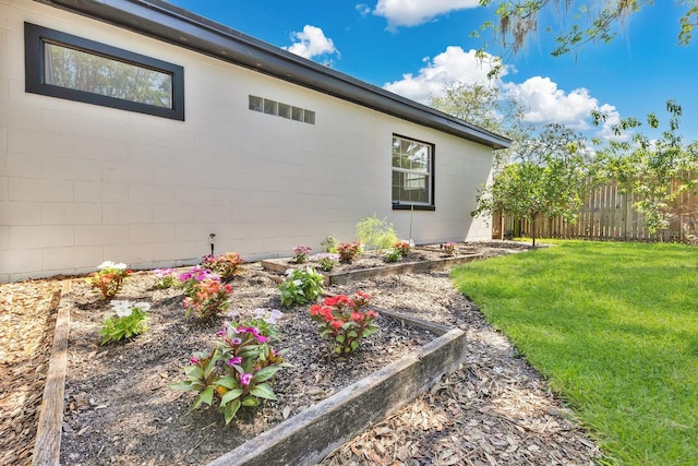 2460 Worthington Rd, Maitland, FL 32751 - view of side of home featuring a vegetable garden and concrete block siding