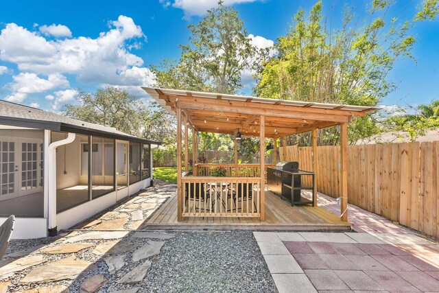 2460 Worthington Rd, Maitland, FL 32751 - fenced backyard with a sunroom and a wooden deck