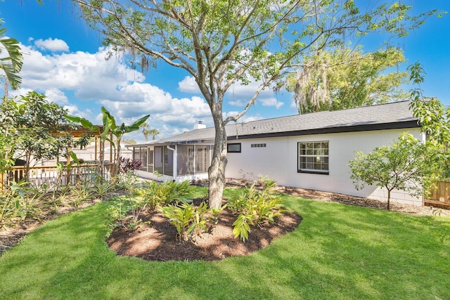 2460 Worthington Rd, Maitland, FL 32751 - rear view of house with a sunroom and a shingled roof