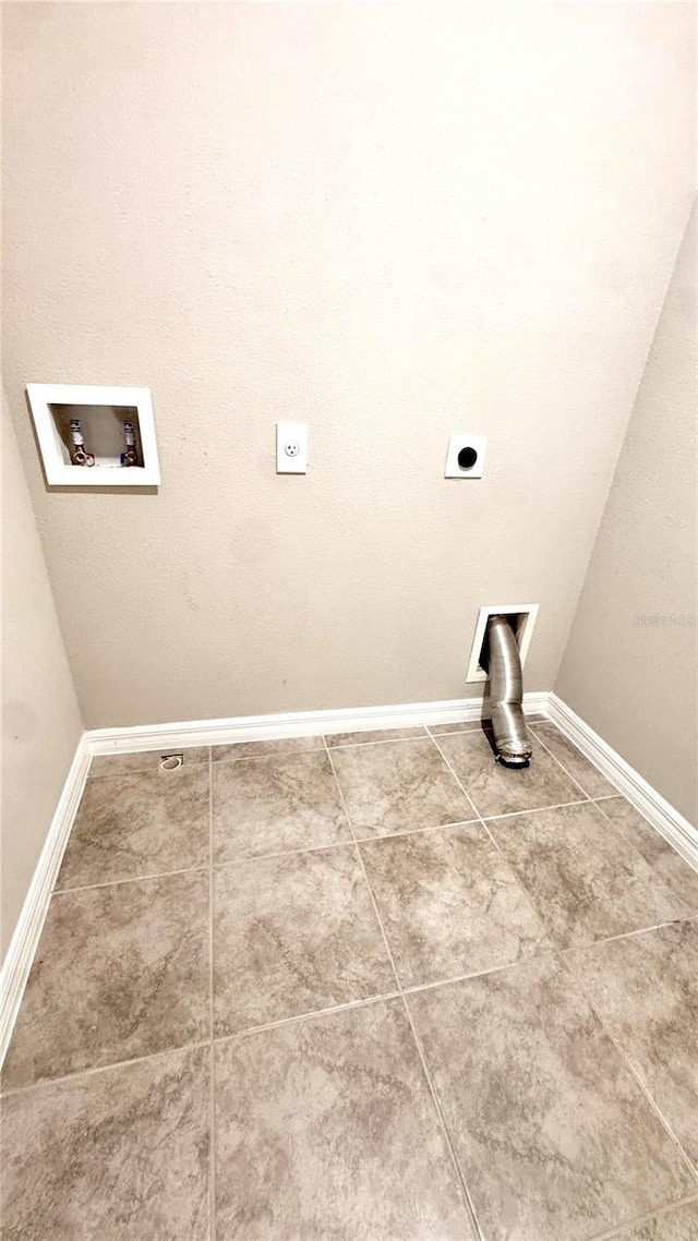 2450 Sweet Viburnum Way, Ocoee, FL 34761 - laundry room with hookup for an electric dryer, hookup for a washing machine, baseboards, and tile patterned flooring