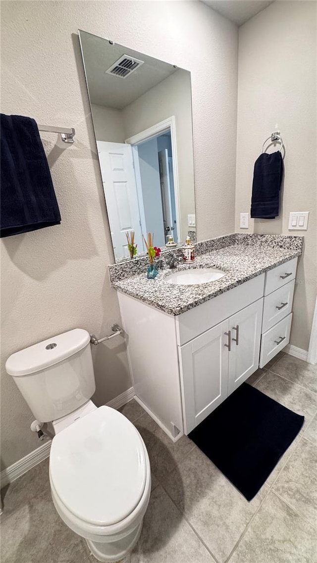 2450 Sweet Viburnum Way, Ocoee, FL 34761 - bathroom featuring vanity, toilet, baseboards, and tile patterned flooring