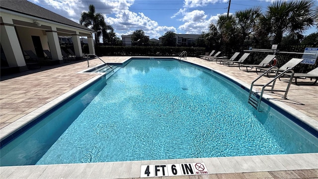 2450 Sweet Viburnum Way, Ocoee, FL 34761 - community pool featuring a patio area