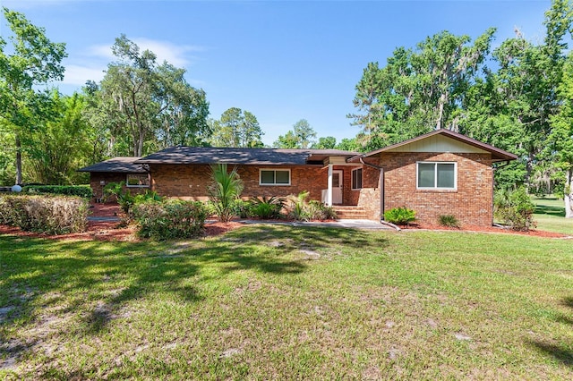 2922 SW 68th Ln, Gainesville, FL 32608 - ranch-style house with a front lawn and brick siding