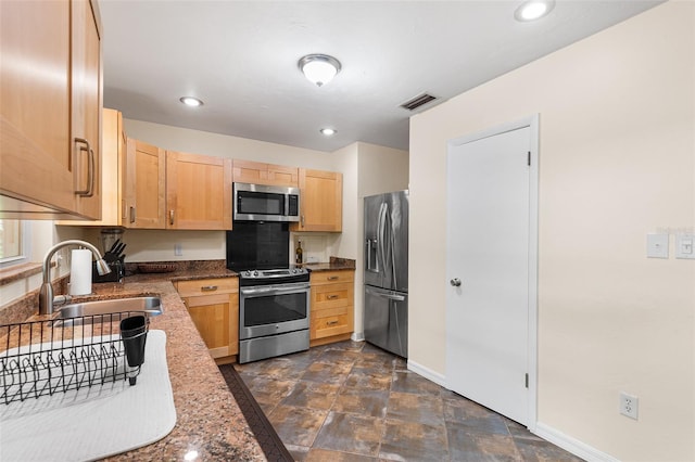 2922 SW 68th Ln, Gainesville, FL 32608 - kitchen with stainless steel appliances, light brown cabinets, recessed lighting, and stone finish floors
