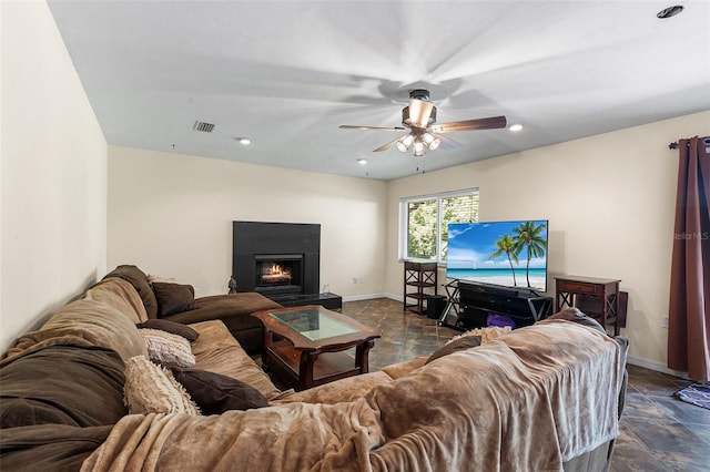 2922 SW 68th Ln, Gainesville, FL 32608 - living area with stone tile flooring, a ceiling fan, a lit fireplace, and recessed lighting