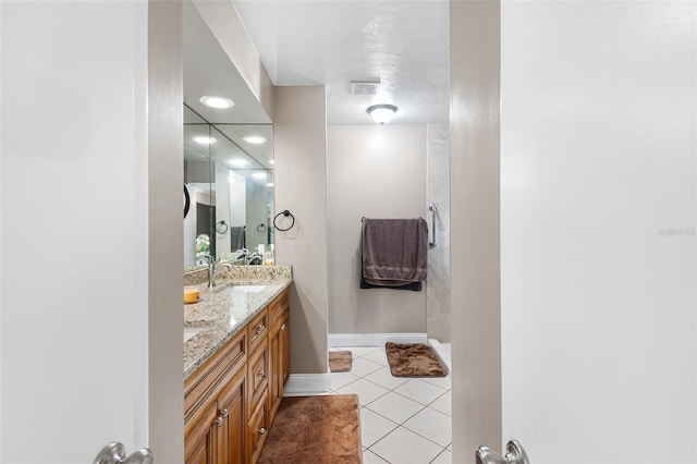 2922 SW 68th Ln, Gainesville, FL 32608 - bathroom featuring double vanity and tile patterned floors