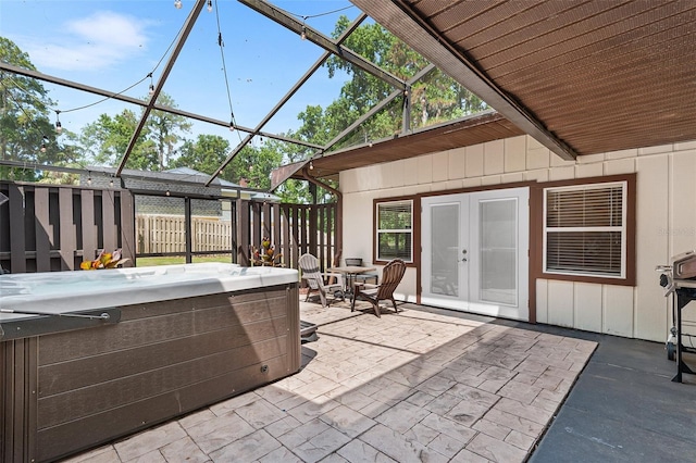 2922 SW 68th Ln, Gainesville, FL 32608 - view of patio with a hot tub, french doors, and a lanai