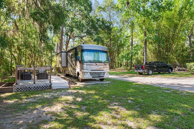 2922 SW 68th Ln, Gainesville, FL 32608 - view of grassy yard featuring a deck