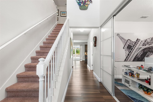 14095 Tropical Kingbird Way, Riverview, FL 33579 - staircase with wood finished floors and baseboards