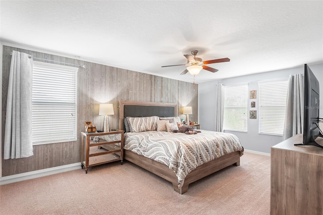 14095 Tropical Kingbird Way, Riverview, FL 33579 - bedroom with baseboards, light carpet, a ceiling fan, and a textured ceiling