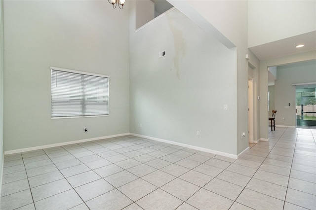 2061 Rush Bay Way, Orlando, FL 32824 - empty room with a high ceiling, light tile patterned floors, and recessed lighting