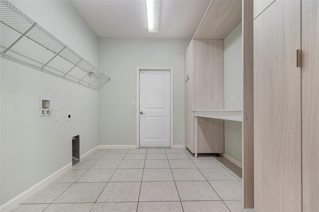 2061 Rush Bay Way, Orlando, FL 32824 - laundry room featuring electric dryer hookup, washer hookup, and light tile patterned floors
