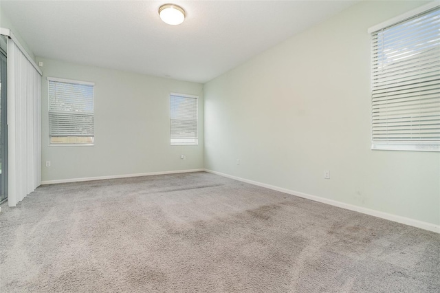 2061 Rush Bay Way, Orlando, FL 32824 - unfurnished bedroom with carpet and multiple windows