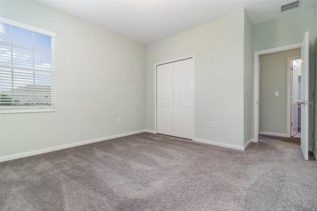 2061 Rush Bay Way, Orlando, FL 32824 - unfurnished bedroom with carpet flooring and a closet