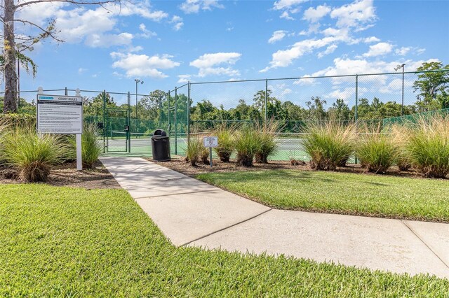 2061 Rush Bay Way, Orlando, FL 32824 - view of community with a tennis court and a gate