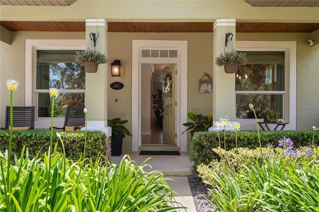 402 S Lake Victoria Cir, Deland, FL 32724 - entrance to property with a porch and stucco siding