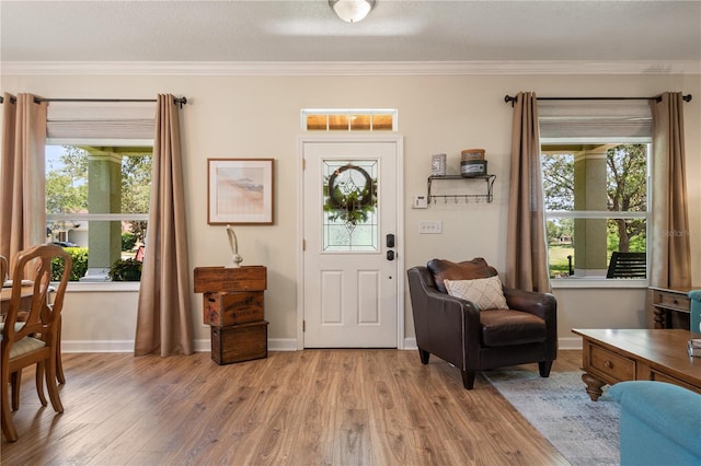402 S Lake Victoria Cir, Deland, FL 32724 - foyer with light wood-type flooring, crown molding, plenty of natural light, and baseboards