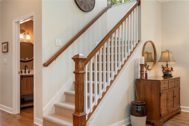 402 S Lake Victoria Cir, Deland, FL 32724 - stairway with wood finished floors and baseboards