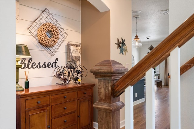402 S Lake Victoria Cir, Deland, FL 32724 - staircase with arched walkways and wood finished floors
