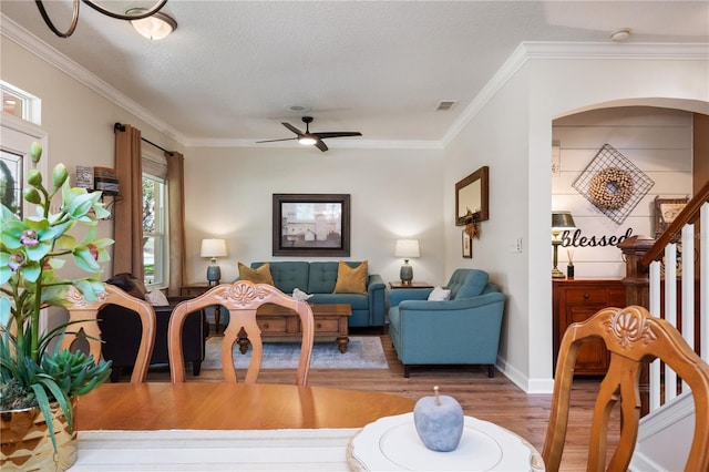 402 S Lake Victoria Cir, Deland, FL 32724 - living area featuring wood finished floors, ceiling fan, ornamental molding, and baseboards