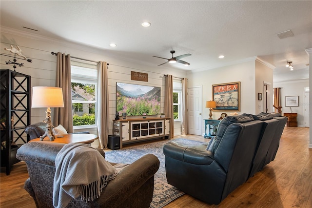 402 S Lake Victoria Cir, Deland, FL 32724 - living area with crown molding, wood finished floors, a ceiling fan, and recessed lighting