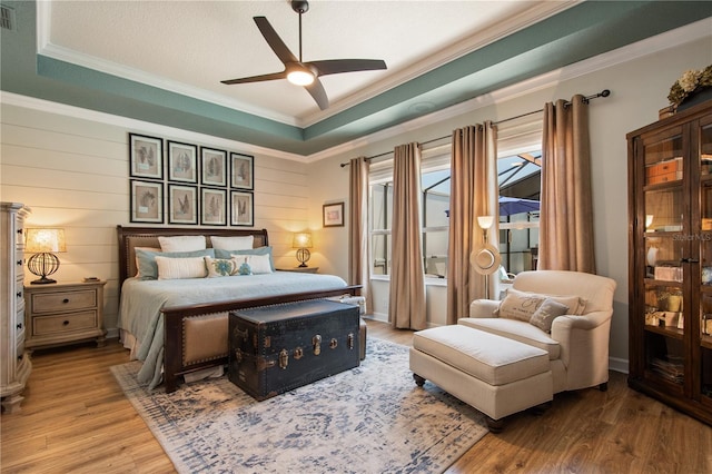 402 S Lake Victoria Cir, Deland, FL 32724 - bedroom featuring wood finished floors, crown molding, access to exterior, and ceiling fan
