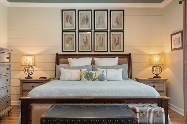 402 S Lake Victoria Cir, Deland, FL 32724 - bedroom with ornamental molding, wood finished floors, and baseboards