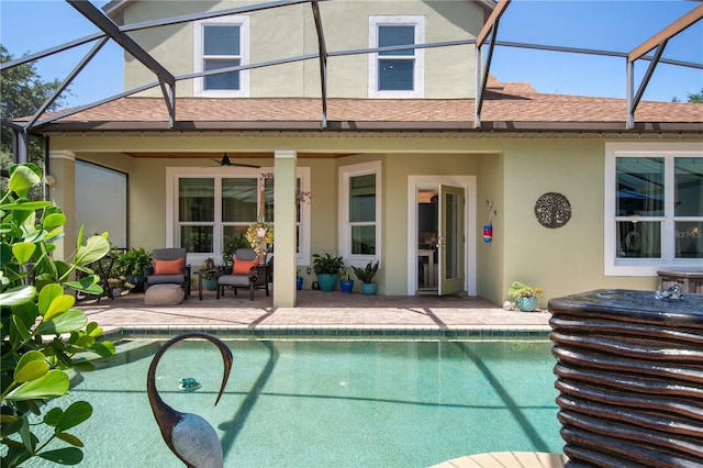 402 S Lake Victoria Cir, Deland, FL 32724 - back of house with stucco siding, a patio, ceiling fan, and an outdoor pool
