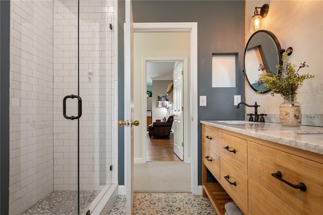 402 S Lake Victoria Cir, Deland, FL 32724 - ensuite bathroom featuring vanity, a stall shower, and baseboards