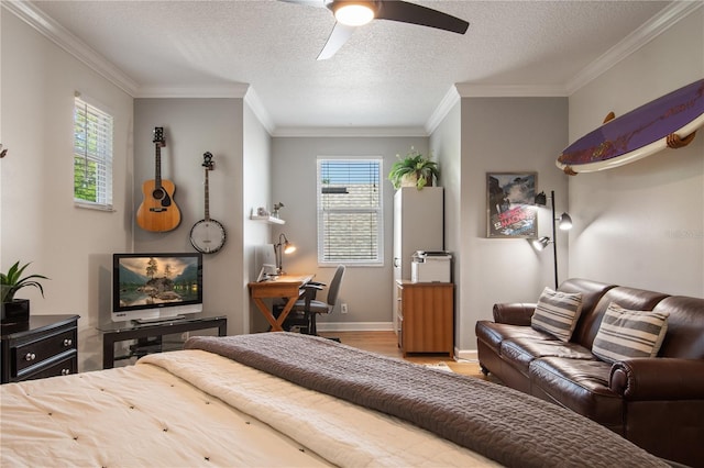 402 S Lake Victoria Cir, Deland, FL 32724 - bedroom featuring wood finished floors, a desk, crown molding, a textured ceiling, and baseboards