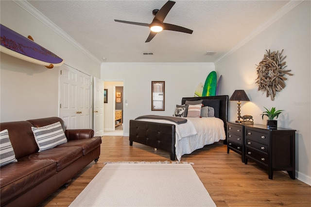 402 S Lake Victoria Cir, Deland, FL 32724 - bedroom featuring ornamental molding, wood finished floors, a textured ceiling, ceiling fan, and baseboards