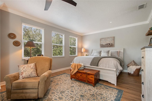 402 S Lake Victoria Cir, Deland, FL 32724 - bedroom featuring wood finished floors, ornamental molding, a ceiling fan, a textured ceiling, and baseboards