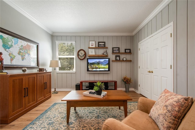 402 S Lake Victoria Cir, Deland, FL 32724 - living area with light wood finished floors, crown molding, a textured ceiling, and baseboards