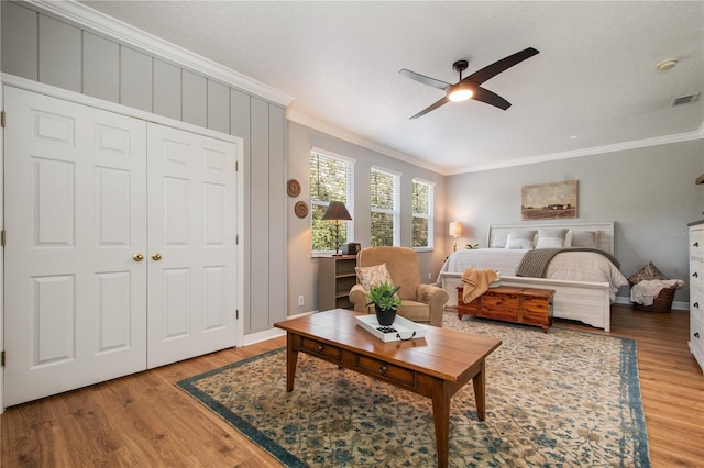 402 S Lake Victoria Cir, Deland, FL 32724 - bedroom featuring ornamental molding, light wood finished floors, baseboards, and a ceiling fan
