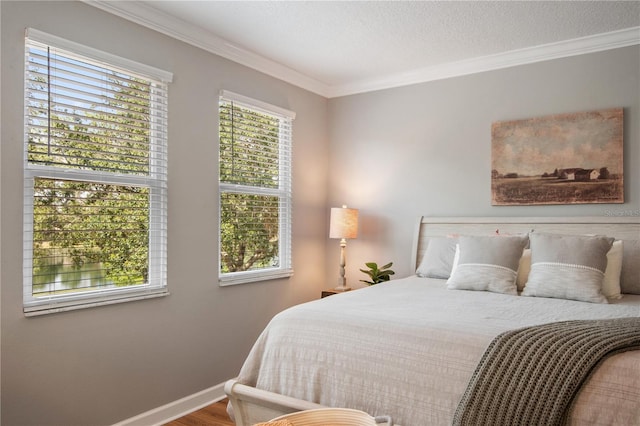 402 S Lake Victoria Cir, Deland, FL 32724 - bedroom featuring ornamental molding, baseboards, and wood finished floors